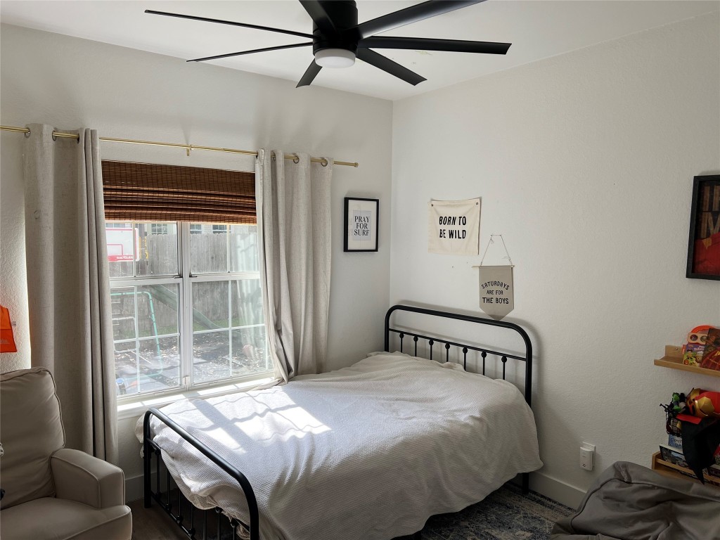 1000 Blue Bird Court Round Rock, TX 78681 - Photo 8 of 10 a bedroom with a bed and a window