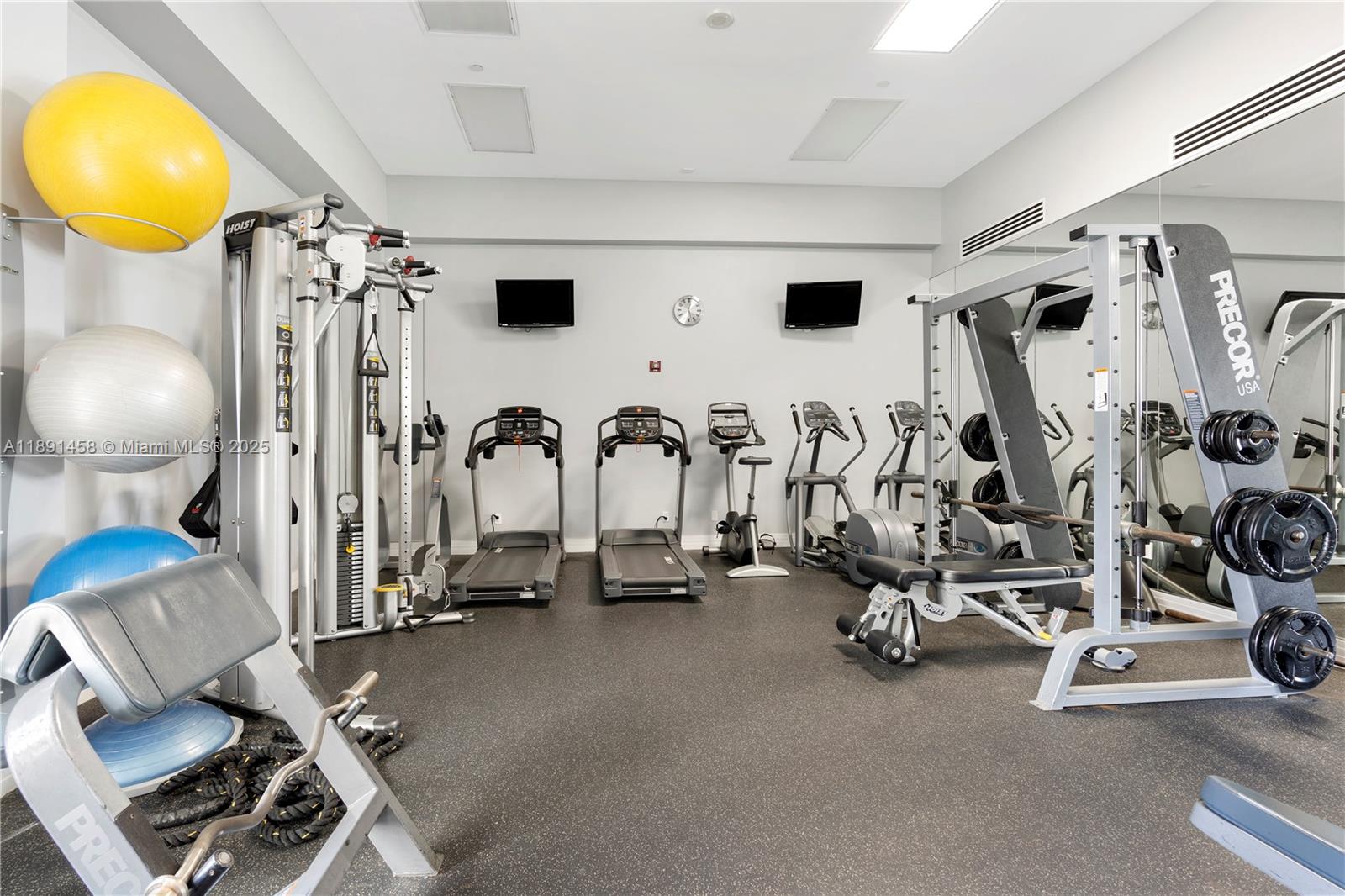 6917 Collins Avenue, Unit 508 Miami Beach, FL 33141 - Photo 13 of 18 a view of a room with gym equipment