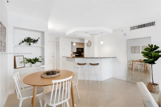 a view of kitchen and dining area with furniture