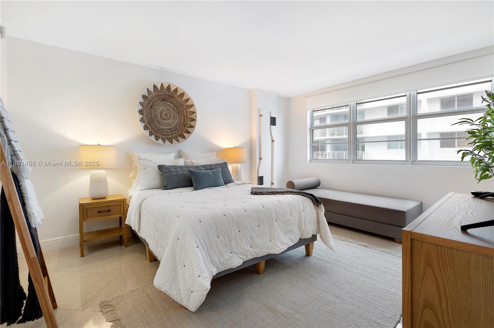 6917 Collins Avenue, Unit 508 Miami Beach, FL 33141 - Photo 8 of 18 a bedroom with a bed and window