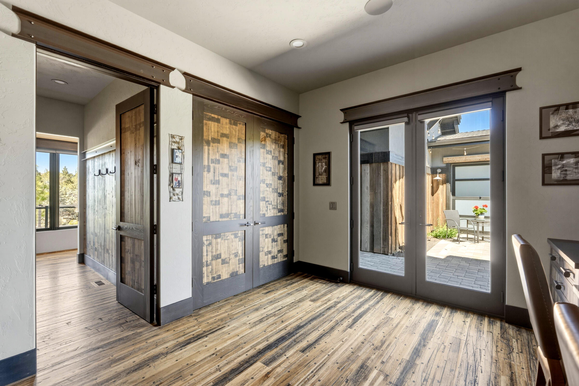 16086 South W Brasada Ranch Road Powell Butte, OR 97753 - Photo 40 of 69 a view of a hallway with wooden floor and glass door
