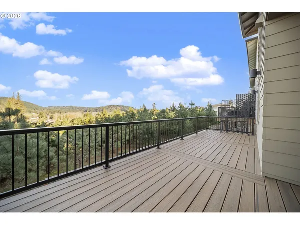 a view of balcony with wooden floor