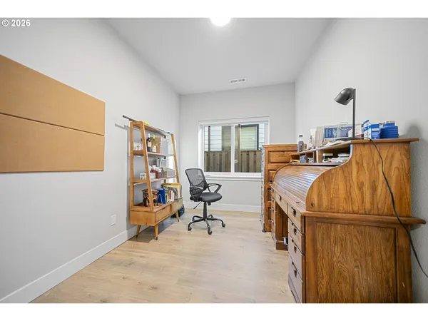 a living room with furniture a air conditioner vent and a window