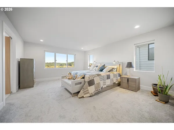 a bed room with furniture and wooden floor