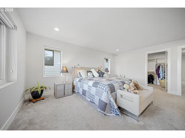 a bed room with a bed and a couch