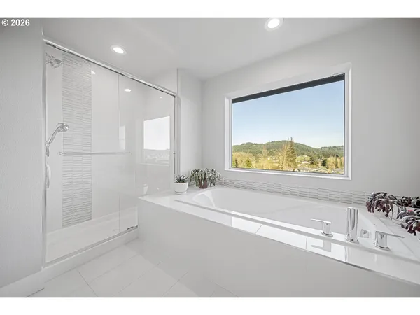 a bathroom with a bathtub and a sink