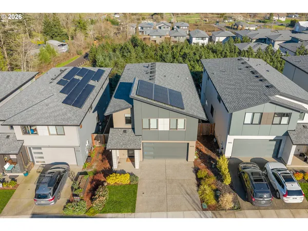 an aerial view of residential houses with outdoor space
