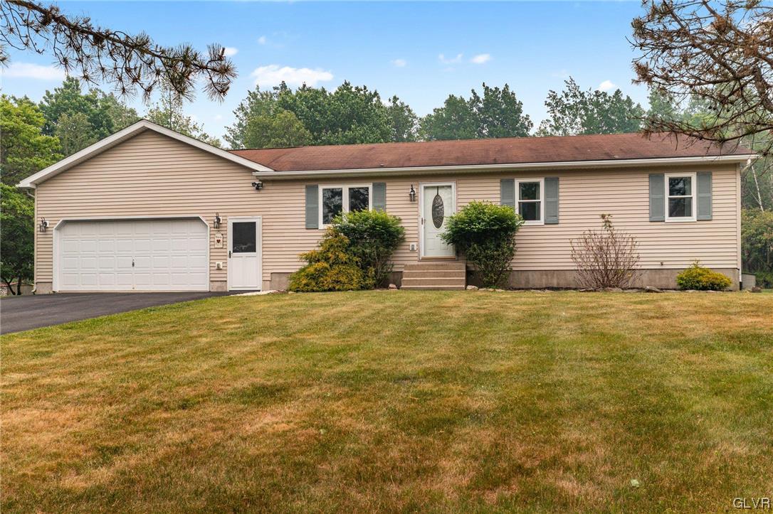 205 Ryan Road Blakeslee, PA 18610 - Photo 1 of 34 a house view with a garden space