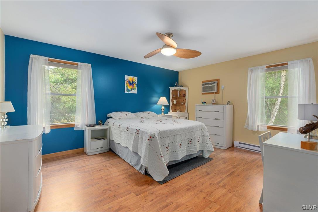 205 Ryan Road Blakeslee, PA 18610 - Photo 12 of 34 a bedroom with a large bed and a large window