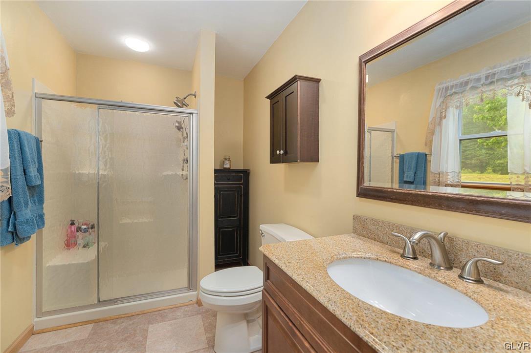 205 Ryan Road Blakeslee, PA 18610 - Photo 14 of 34 a bathroom with a sink toilet and shower