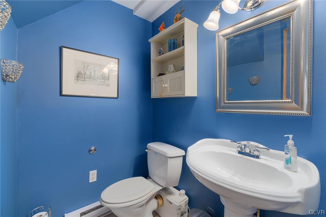 205 Ryan Road Blakeslee, PA 18610 - Photo 16 of 34 a bathroom with a toilet a sink and mirror