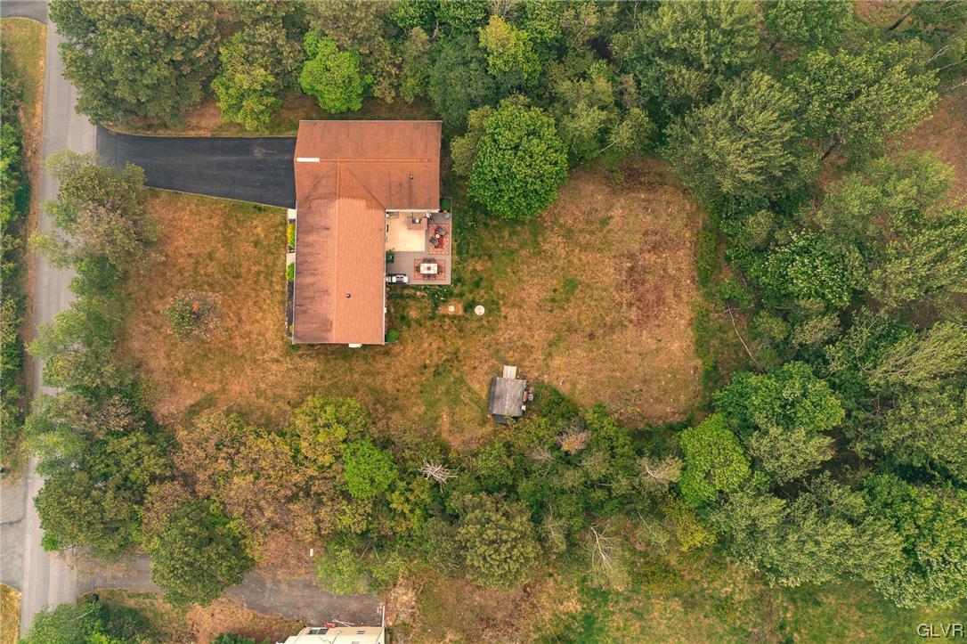 205 Ryan Road Blakeslee, PA 18610 - Photo 31 of 34 an aerial view of a house with a yard and trees all around