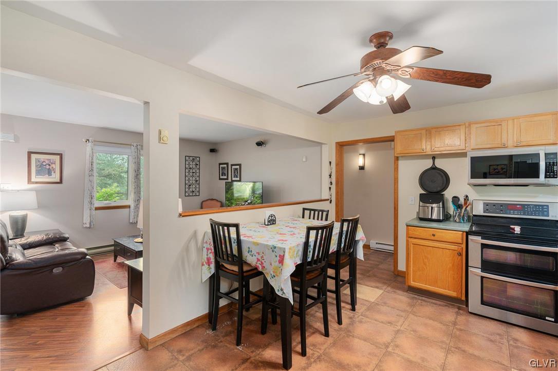 205 Ryan Road Blakeslee, PA 18610 - Photo 6 of 34 a view of a dining room with furniture and a chandelier