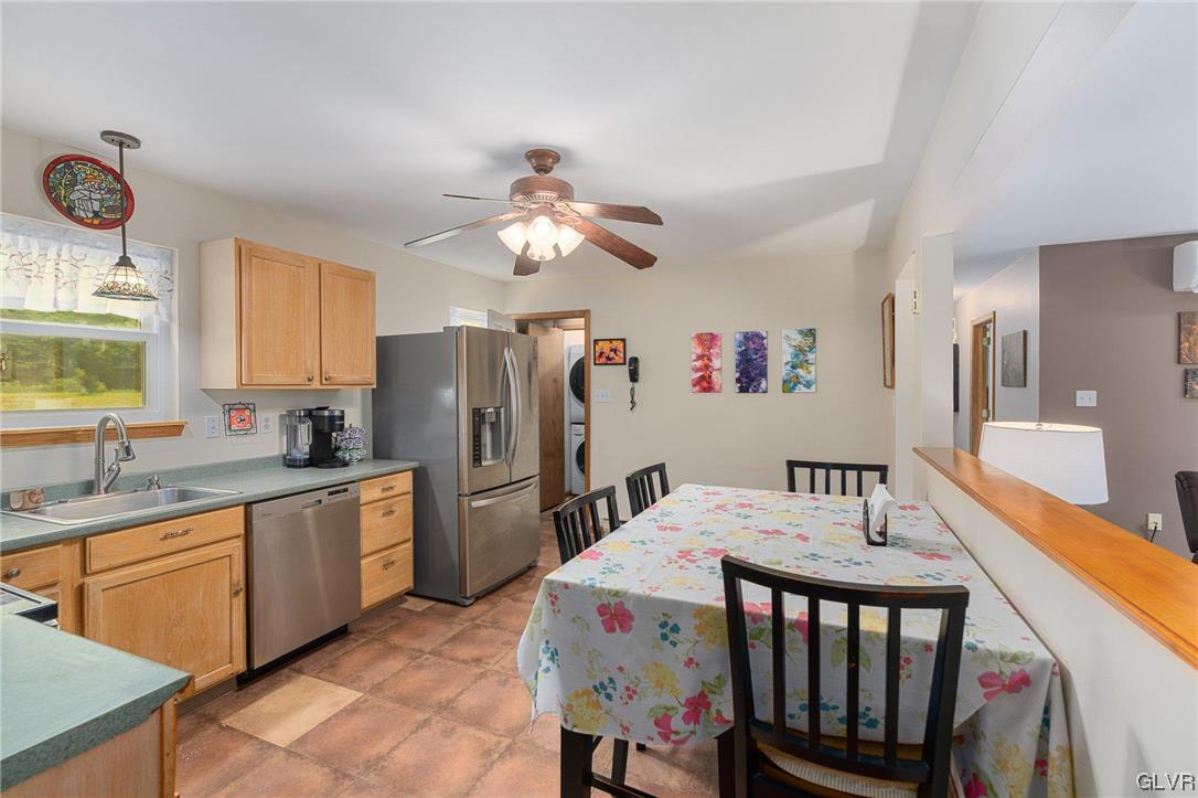 205 Ryan Road Blakeslee, PA 18610 - Photo 7 of 34 a open kitchen with stainless steel appliances granite countertop a dining table and chairs