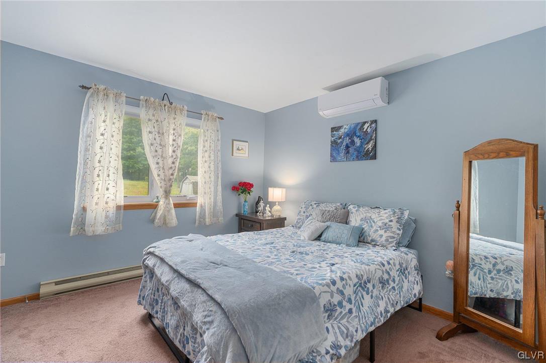 205 Ryan Road Blakeslee, PA 18610 - Photo 9 of 34 a bedroom with a bed and a window