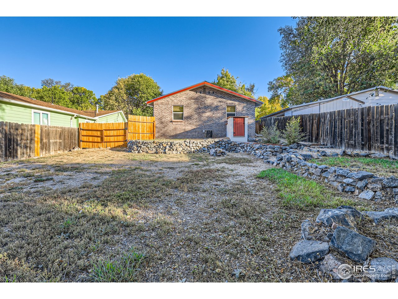 25 Reed Place Longmont, CO 80504 - Photo 18 of 30 a view of a house with a yard