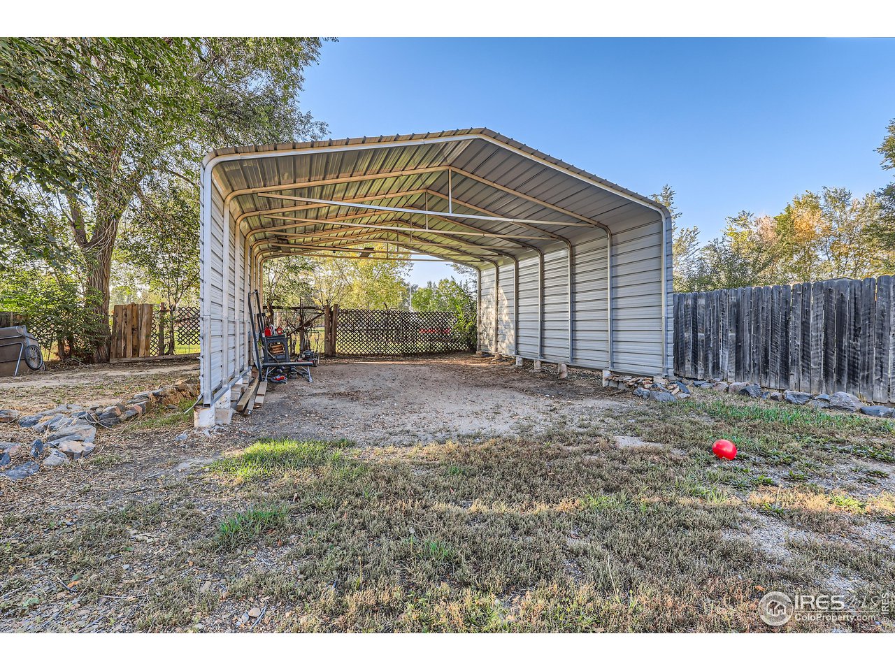 25 Reed Place Longmont, CO 80504 - Photo 20 of 30 a backyard of a house with table and chairs