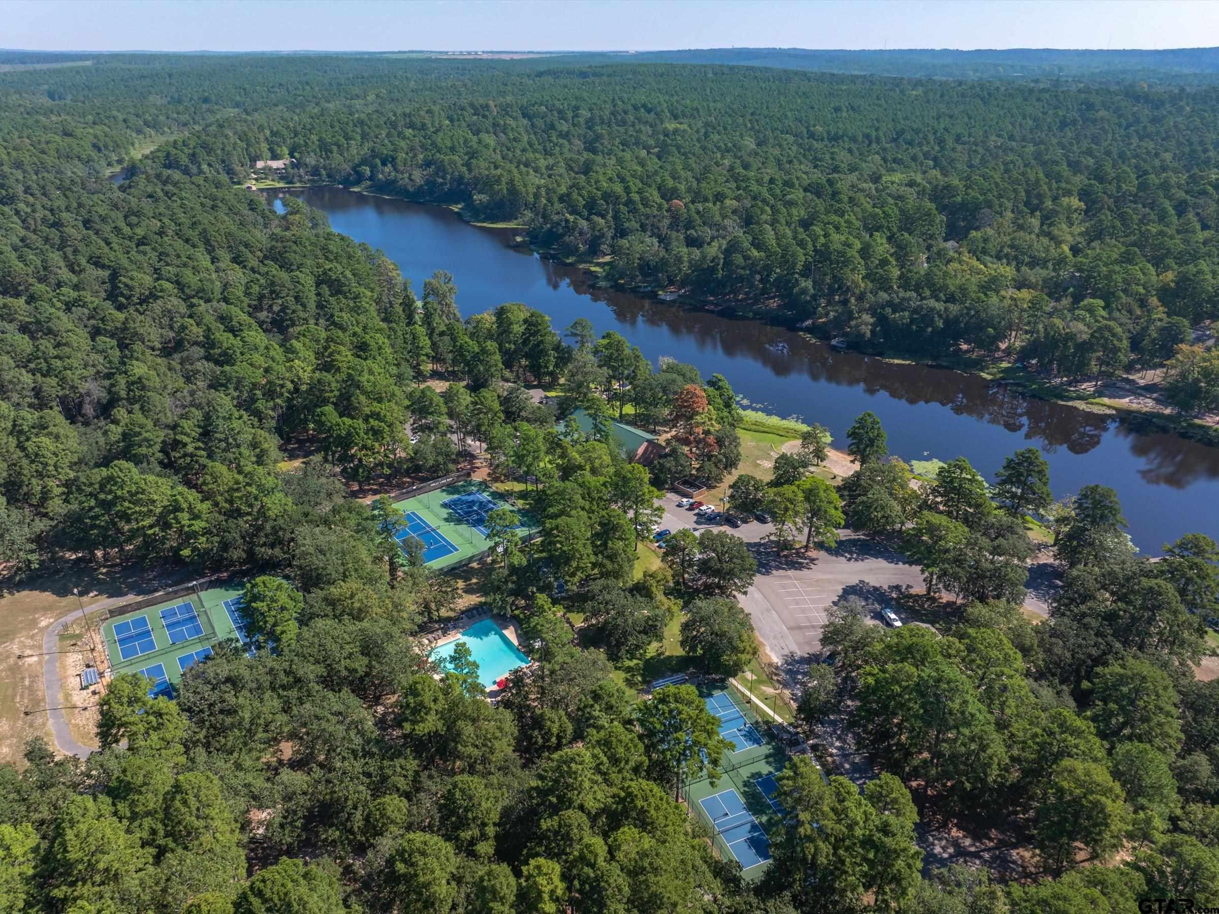 289 Llano Bend Holly Lake Ranch, TX 75765 - Photo 43 of 48 an aerial view of residential house with outdoor space and trees all around