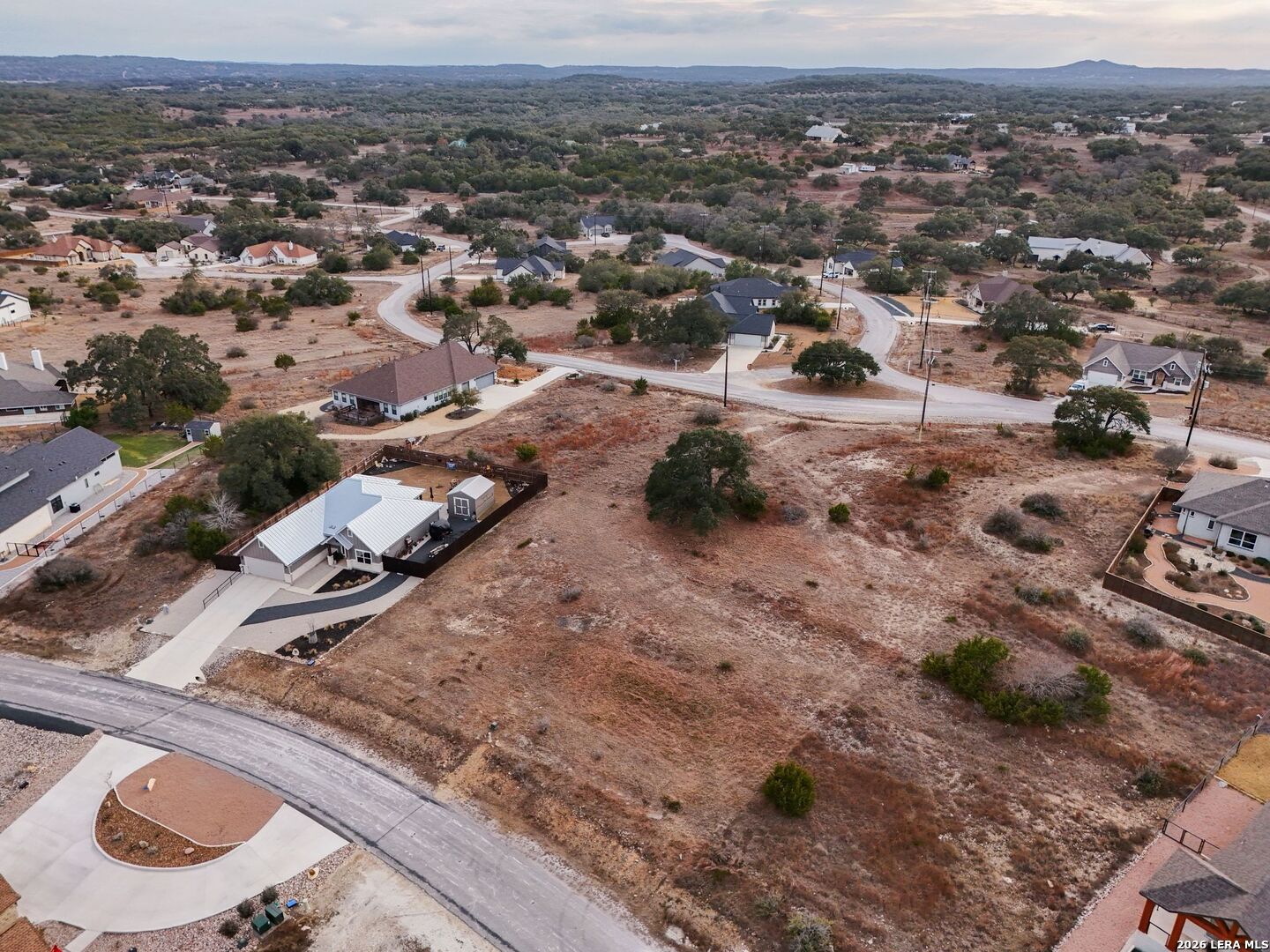 126 Lewis Todd Blanco, TX 78606 - Photo 8 of 8 an aerial view of residential houses with outdoor space