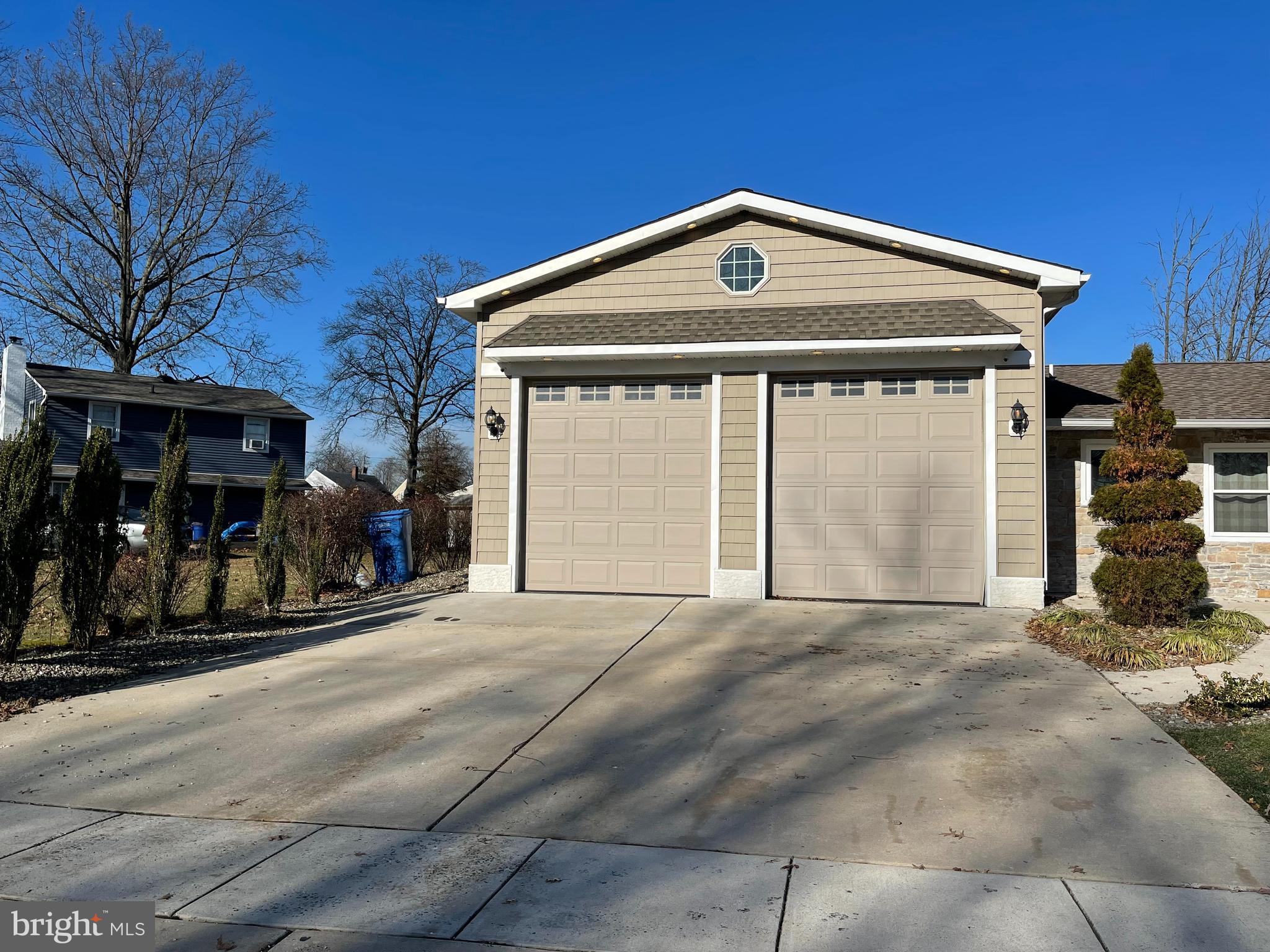 9 Gatewood Road Levittown, PA 19057 - Photo 4 of 72 24'x25' concrete driveway and 12 ft garage doors