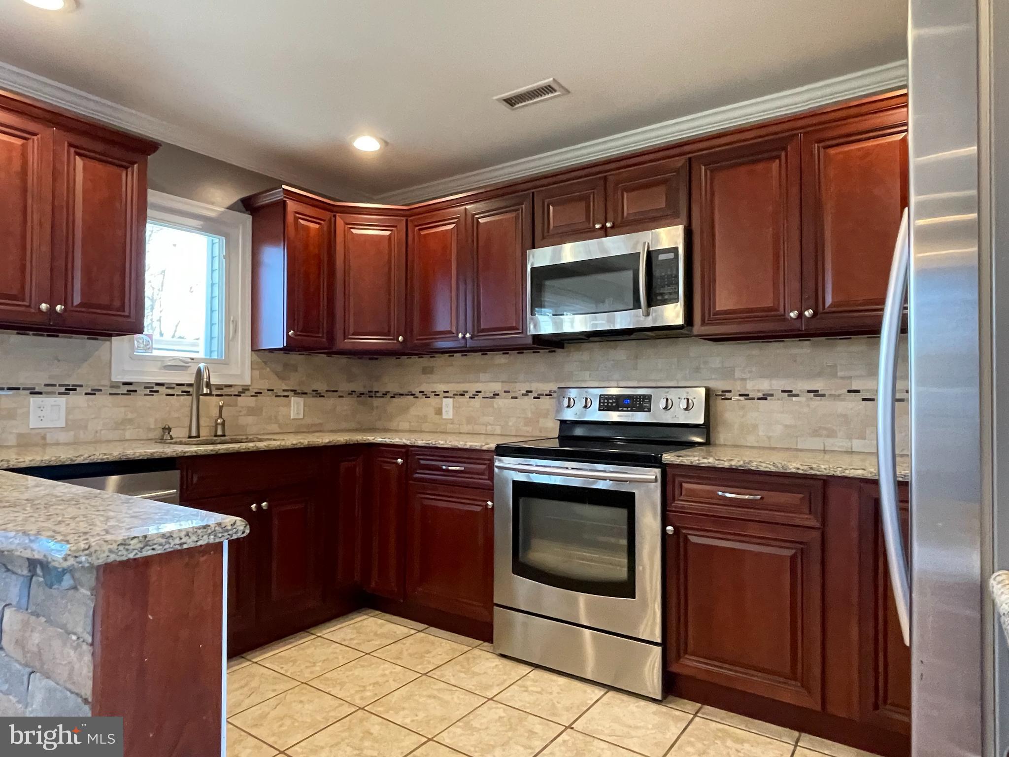 9 Gatewood Road Levittown, PA 19057 - Photo 8 of 72 Custom kitchen w/ Granite CT & SS appliances