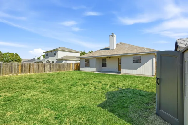 a front view of a house with yard