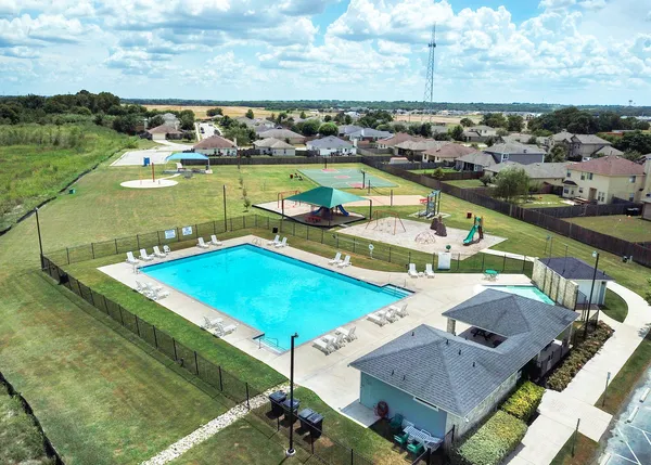an aerial view of a house with pool lake view and mountain view