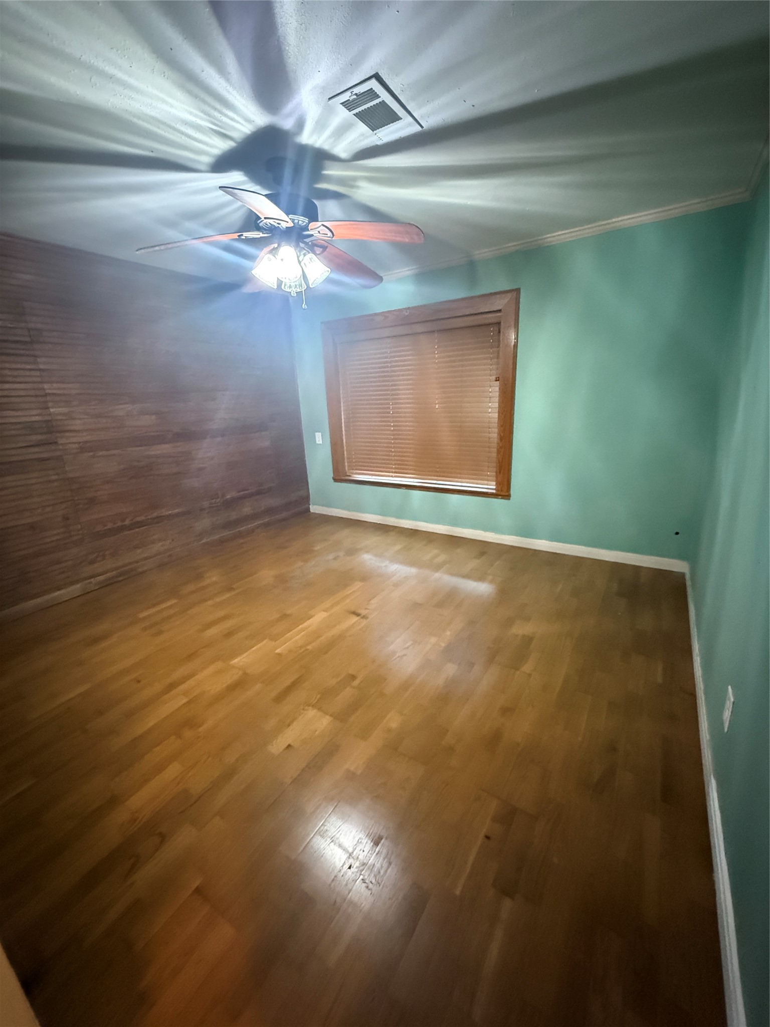 795 Highway 393 Loop Goodrich, TX 77335 - Photo 20 of 22 a view of a room with a ceiling fan and a window