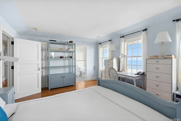 a room with a dresser and a window