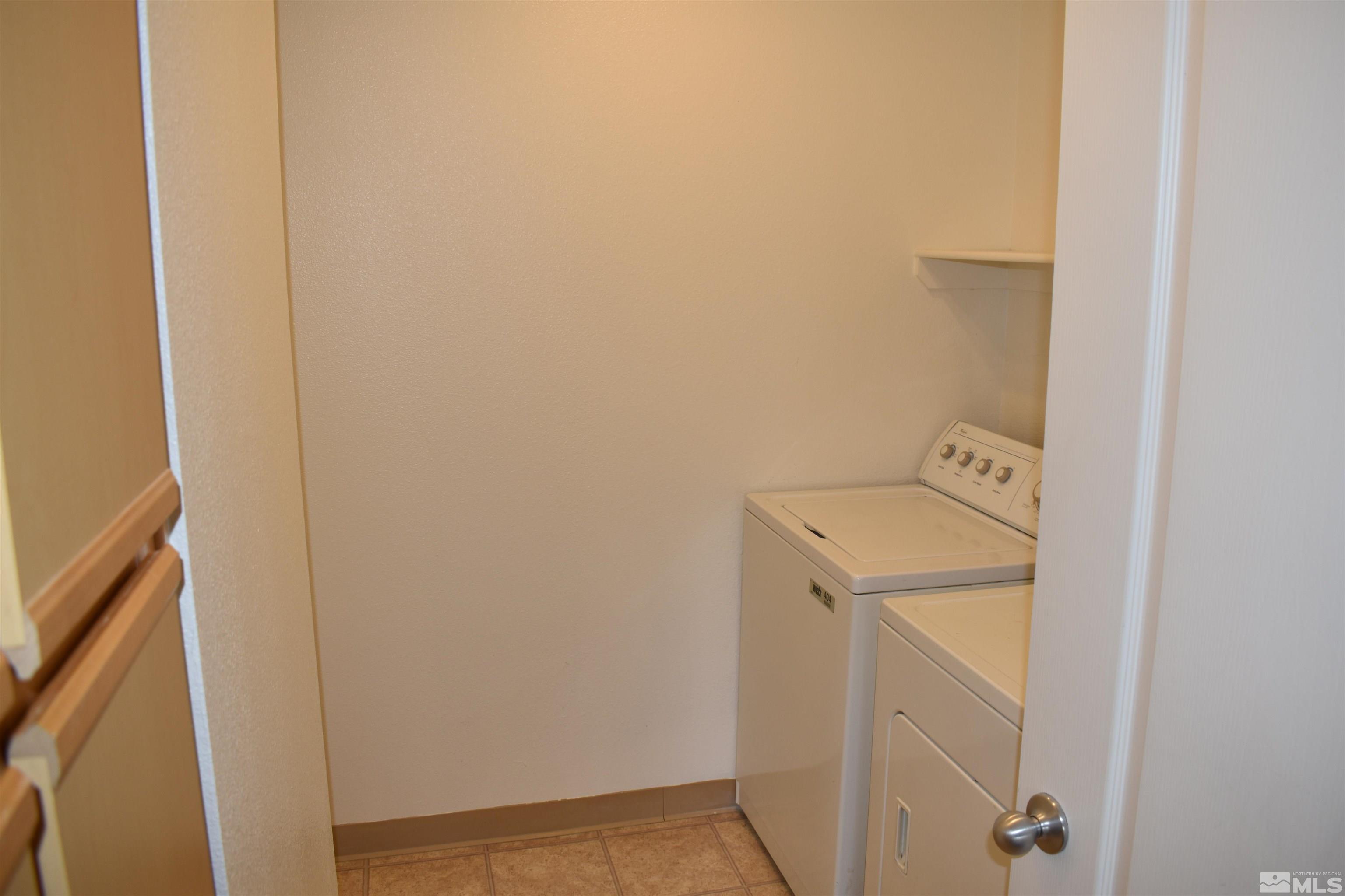 6850 Sharlands Avenue, Unit W1133 Reno, NV 89523 - Photo 13 of 17 a utility room with dryer and washer