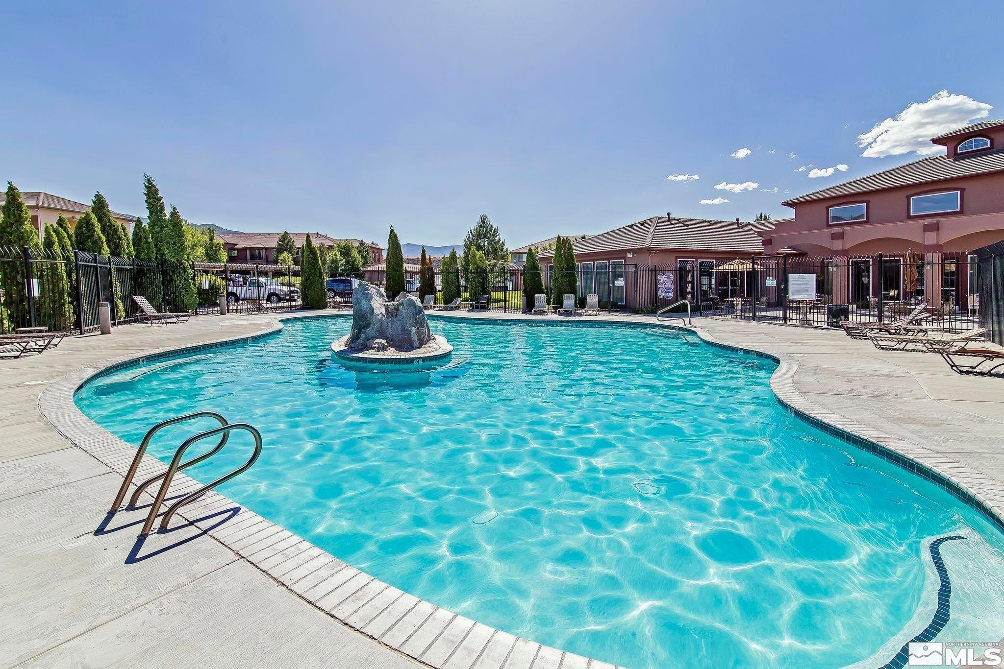 6850 Sharlands Avenue, Unit W1133 Reno, NV 89523 - Photo 16 of 17 a view of a swimming pool with a patio