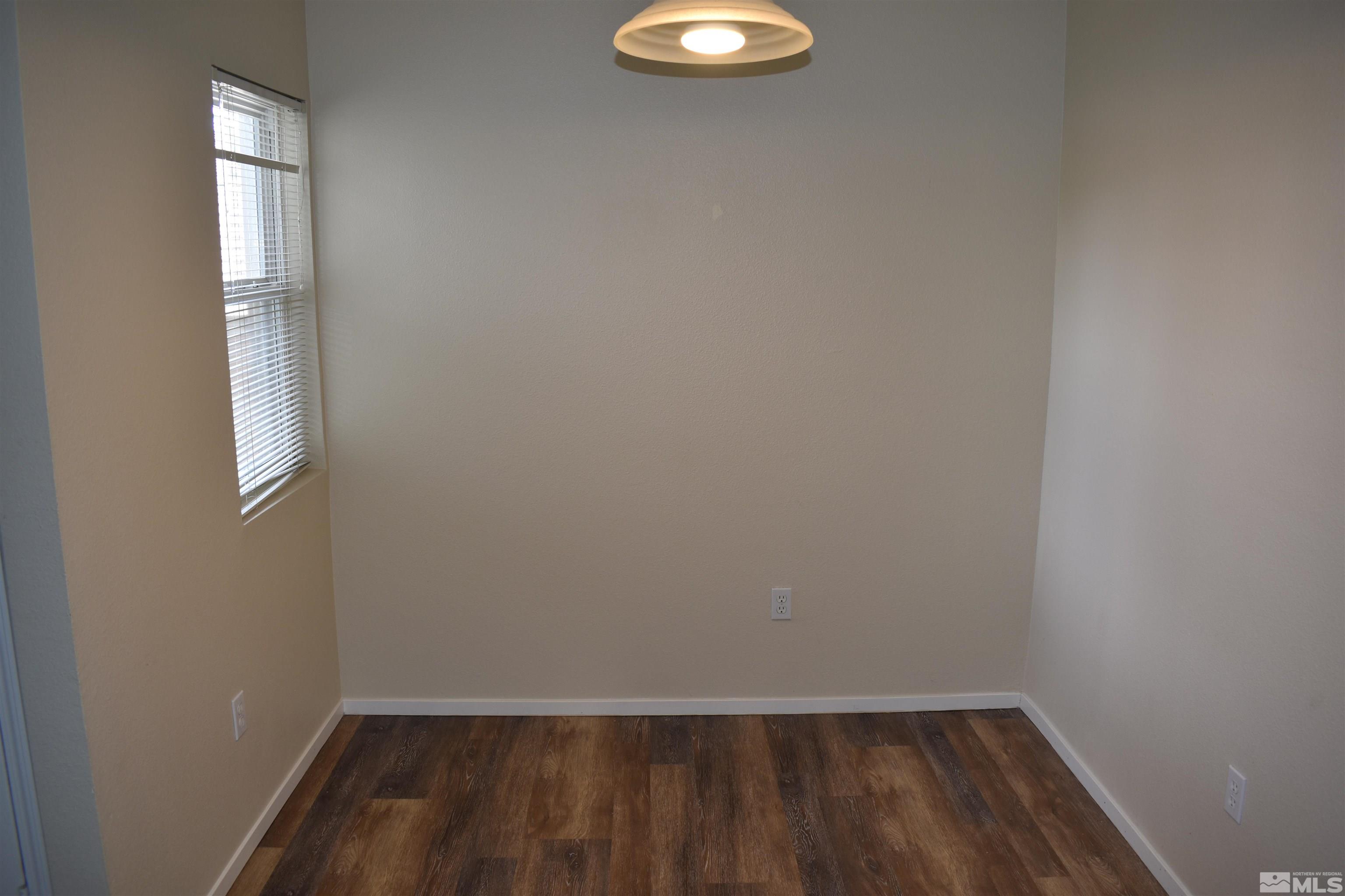 6850 Sharlands Avenue, Unit W1133 Reno, NV 89523 - Photo 8 of 17 a view of a small space with wooden floor and a window