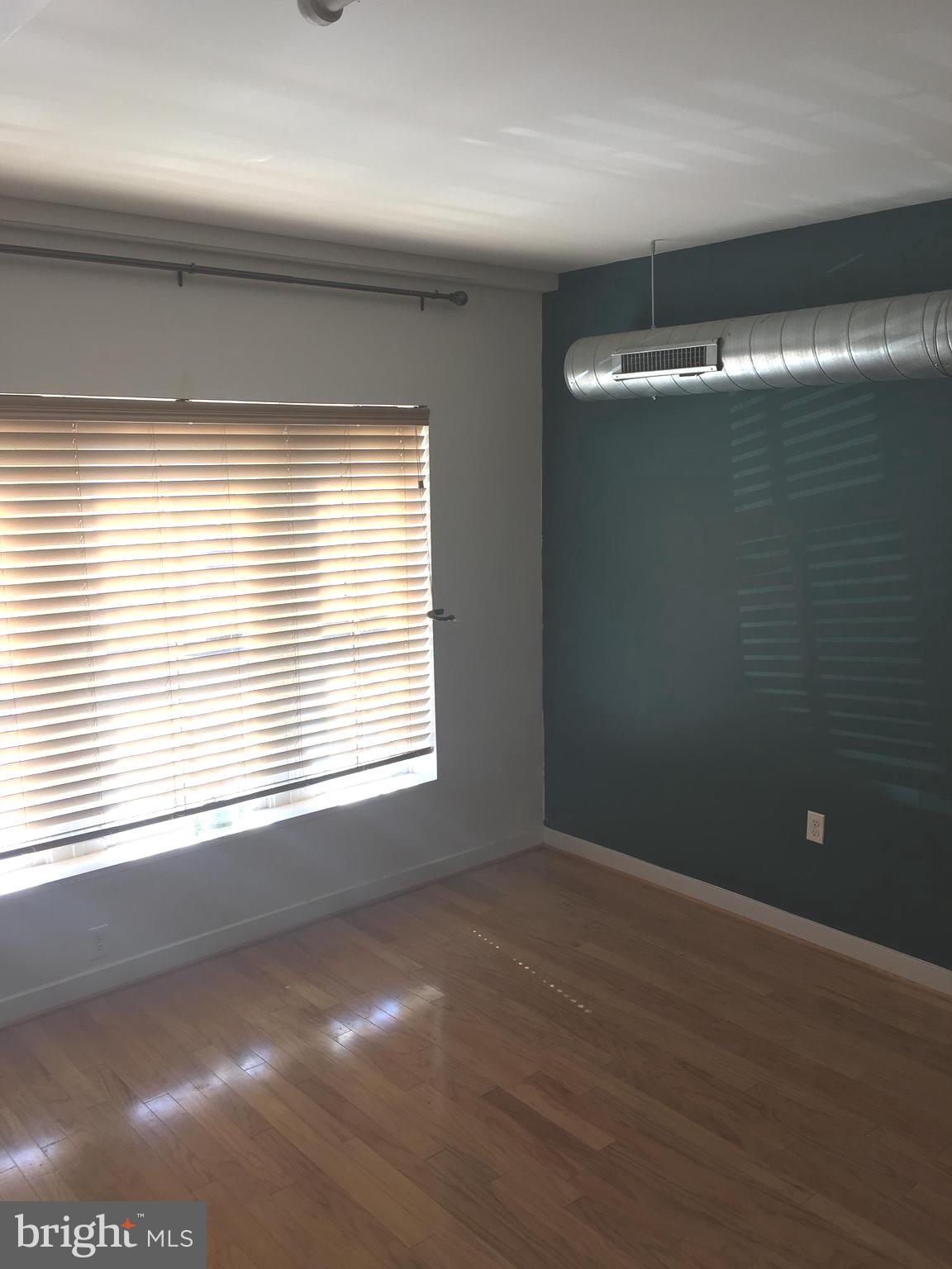 242 Centre Street, Unit 12 Trenton, NJ 08611 - Photo 12 of 23 a view of an empty room with a window