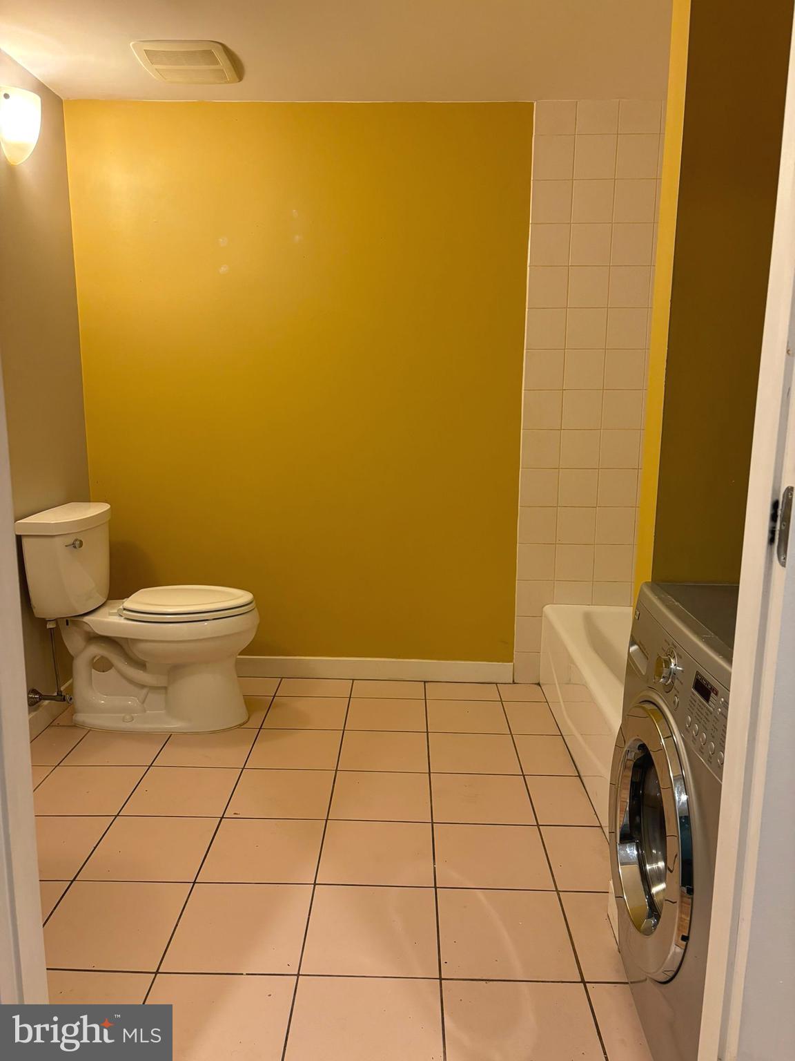242 Centre Street, Unit 12 Trenton, NJ 08611 - Photo 14 of 23 a bathroom with a sink and a toilet