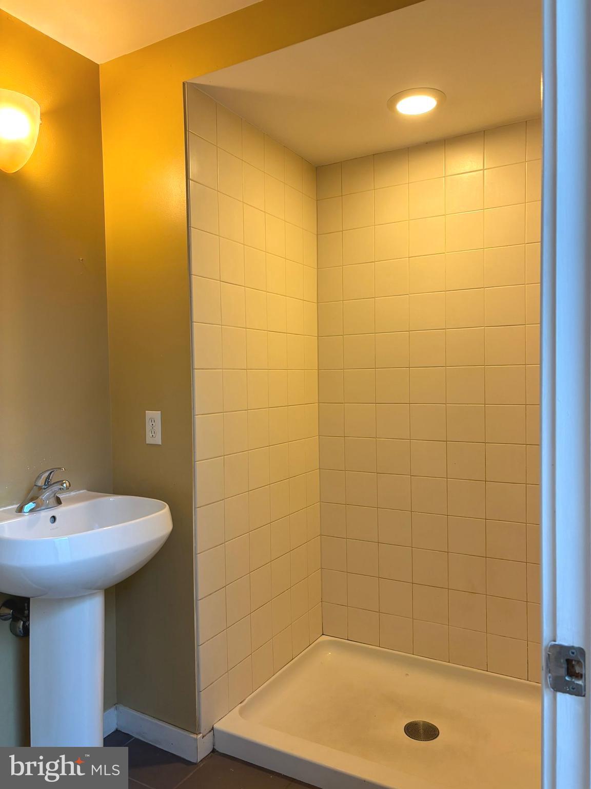 242 Centre Street, Unit 12 Trenton, NJ 08611 - Photo 22 of 23 a bathroom with a shower