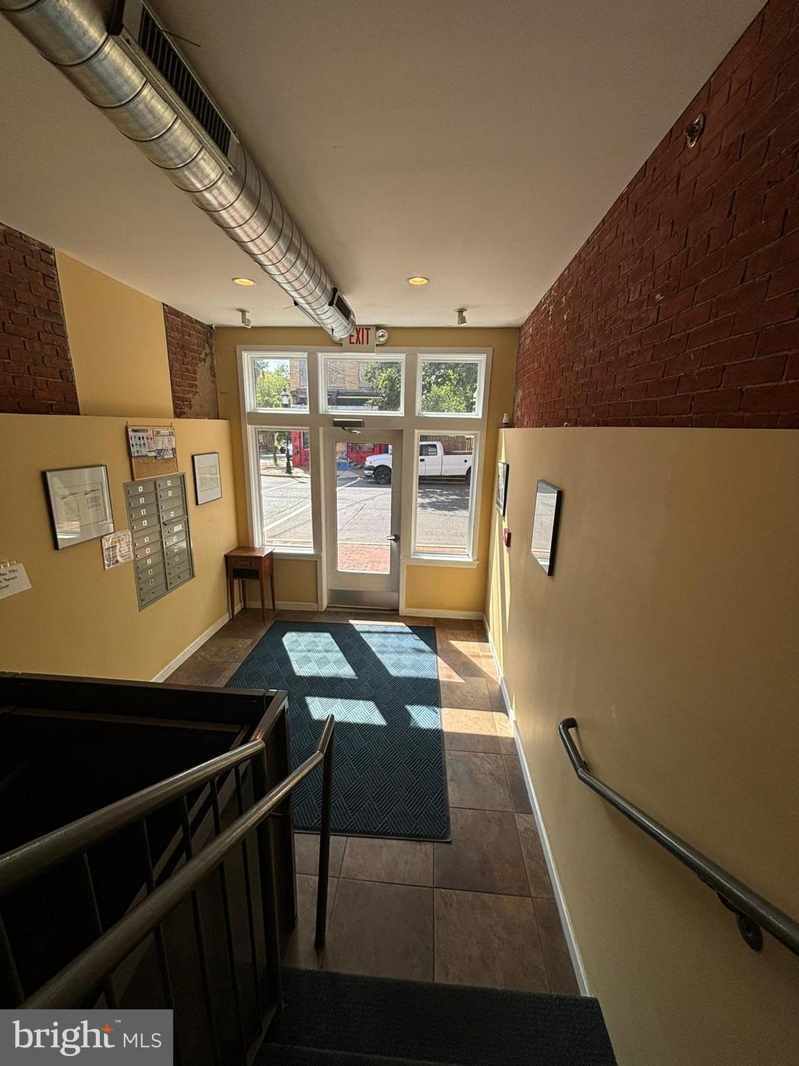 242 Centre Street, Unit 12 Trenton, NJ 08611 - Photo 4 of 23 a view of a hallway with seating area