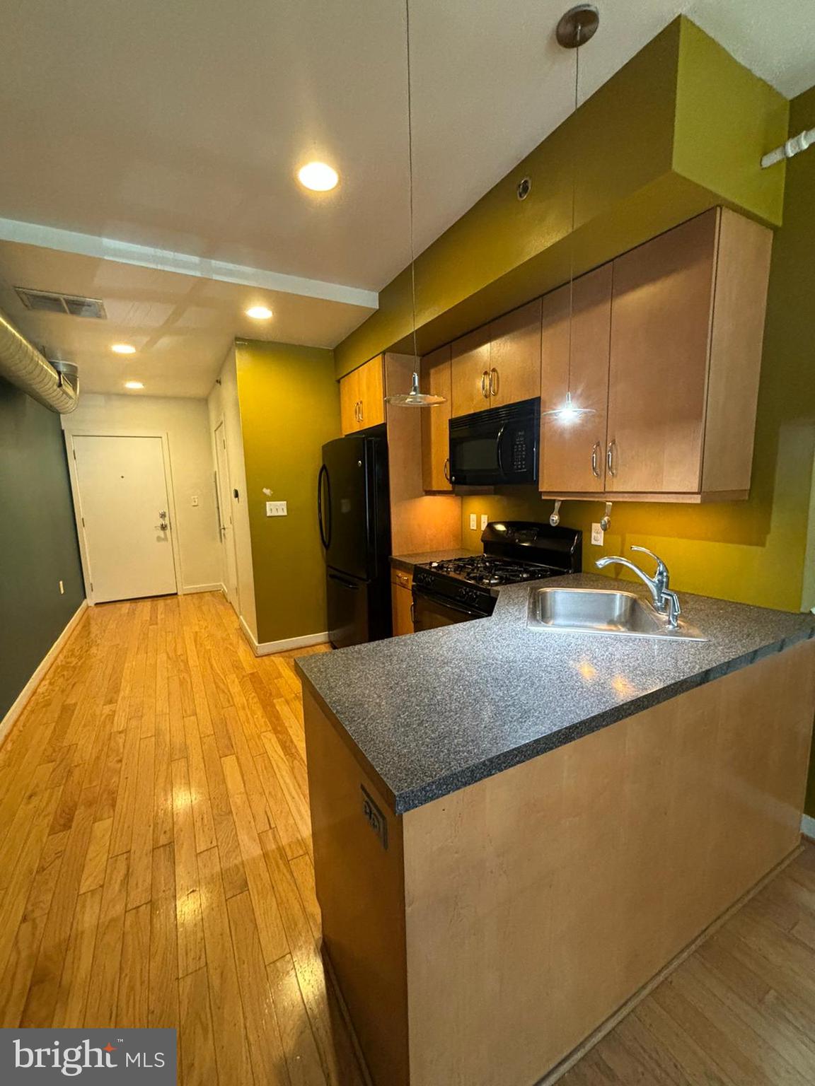 242 Centre Street, Unit 12 Trenton, NJ 08611 - Photo 7 of 23 a bathroom with a sink and a mirror