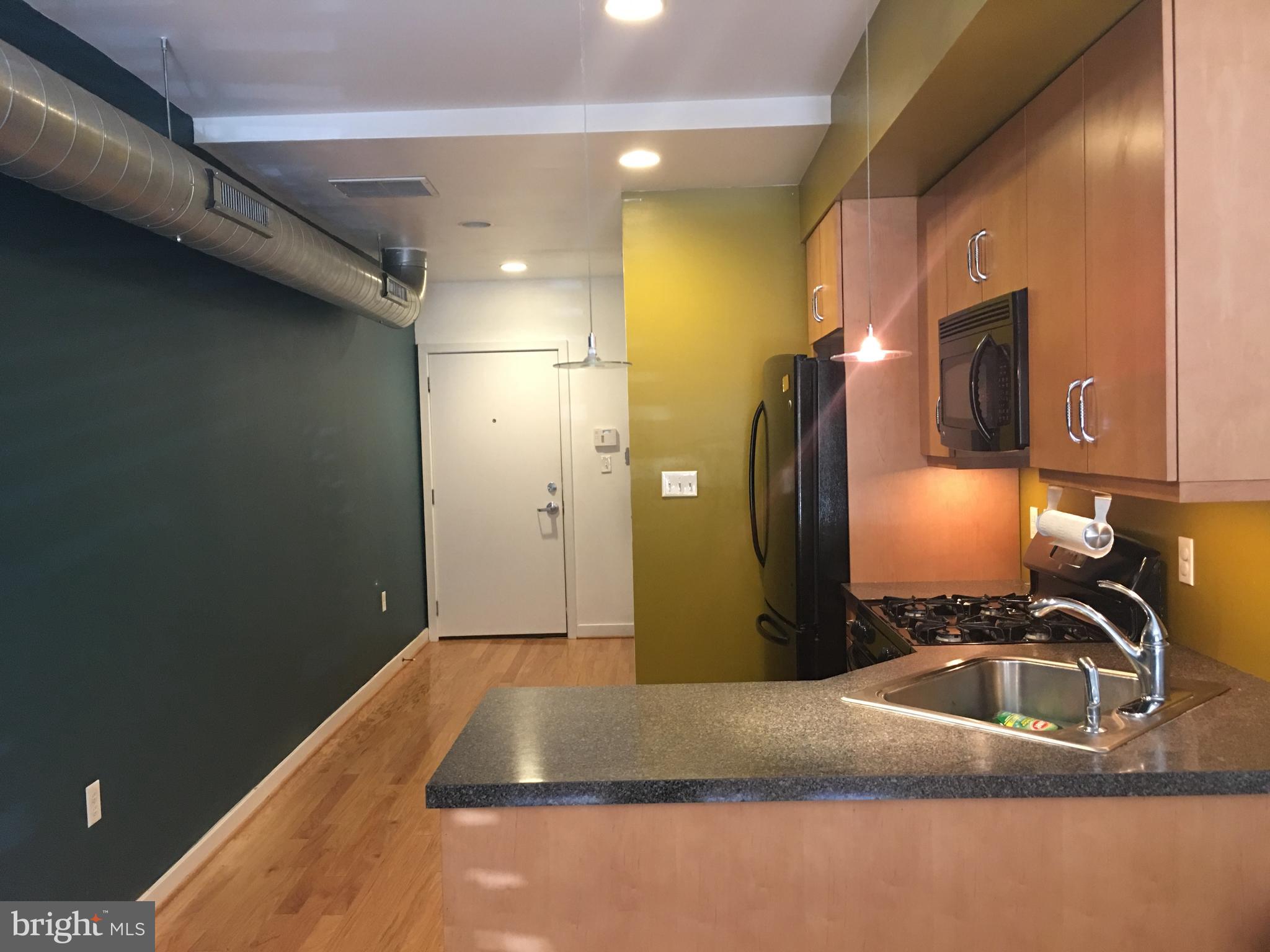 242 Centre Street, Unit 12 Trenton, NJ 08611 - Photo 9 of 23 a bathroom with a sink and a mirror