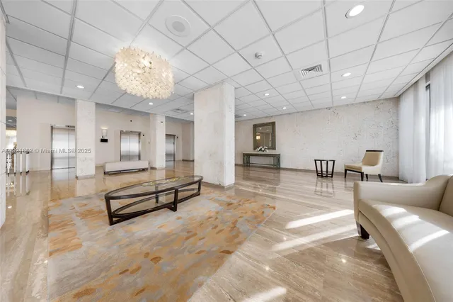 a view of a livingroom with furniture and a chandelier