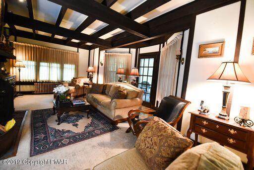 127 Piney Road Cresco, PA 18326 - Photo 8 of 47 Living Room with Doors to Screened Porch