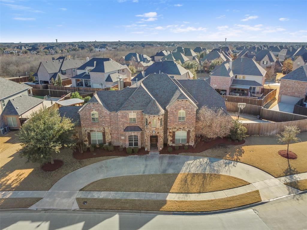 4429 Chevy Chase Lane Frisco, TX 75033 - Photo 1 of 38 an aerial view of a house with a swimming pool