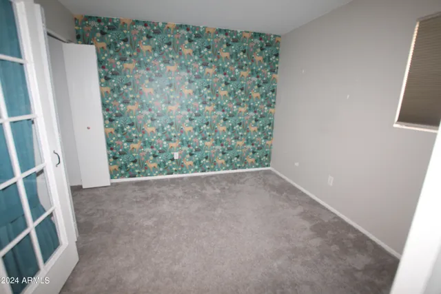 a balcony with table and chairs