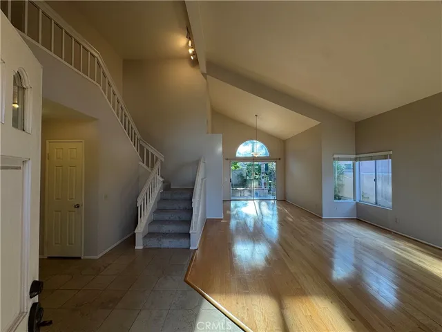 a view of entryway with wooden floor