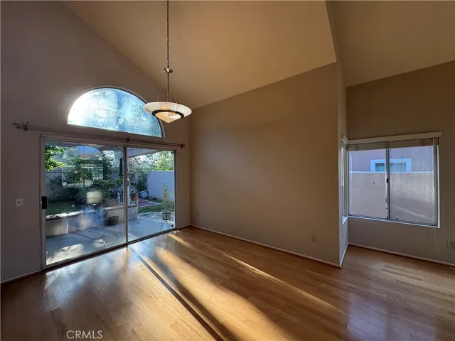 a view of a room with wooden floor and iron gate
