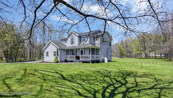 a view of a house with a big yard
