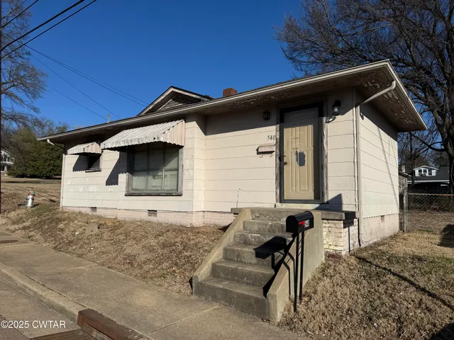 a front view of a house with patio