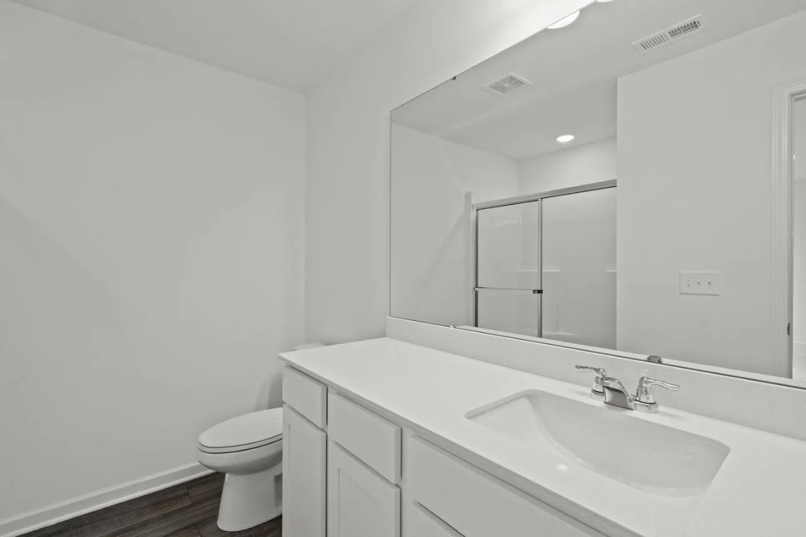 2458 Spring Rise Lane Crosby, TX 77532 - Photo 11 of 17 a bathroom with a sink toilet and vanity
