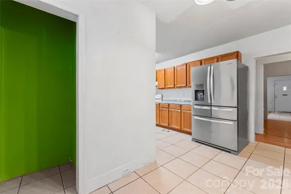 a kitchen with stainless steel appliances a refrigerator and a sink