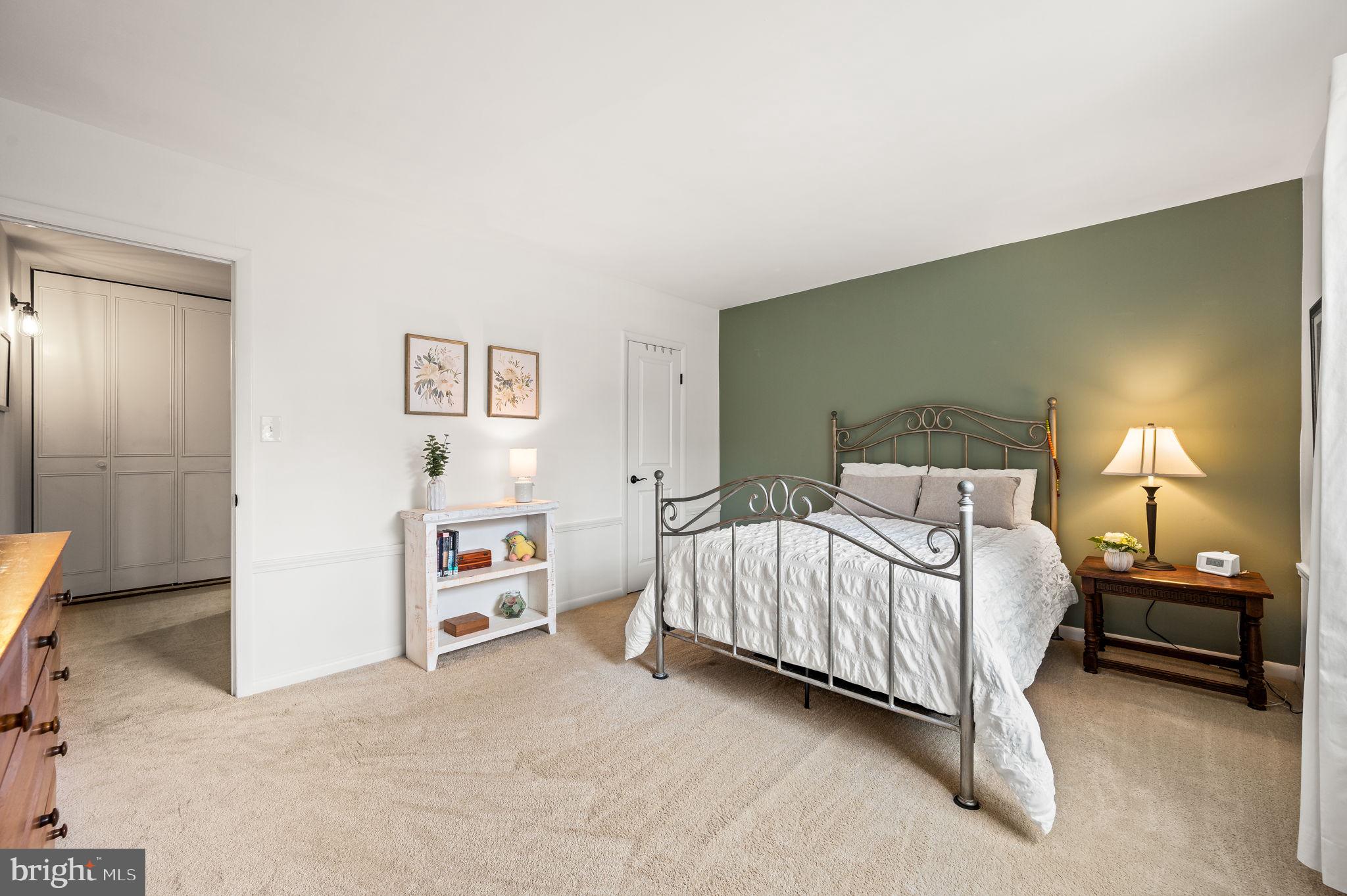 307 Old Forge Crossing Devon, PA 19333 - Photo 16 of 29 a bedroom with a bed and a walk in closet