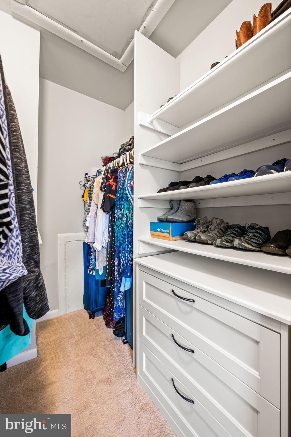 307 Old Forge Crossing Devon, PA 19333 - Photo 17 of 29 a view of walk in closet with clothes and shoes